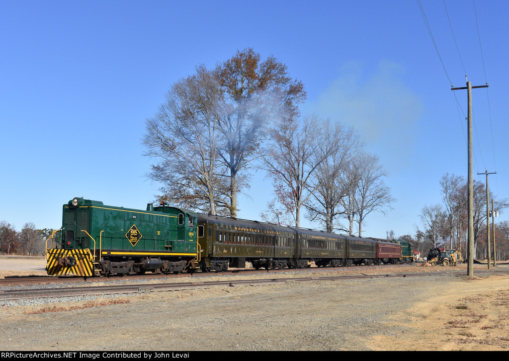 The very proud Baldwin S-12 304 and the passenger consist proceed back south for another runby in S. Woodstown while the 0-6-0 9 steam locomotive sits in the background 